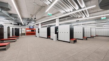 A modern changing room with lockers and benches. The walls are bright and the lighting is good.